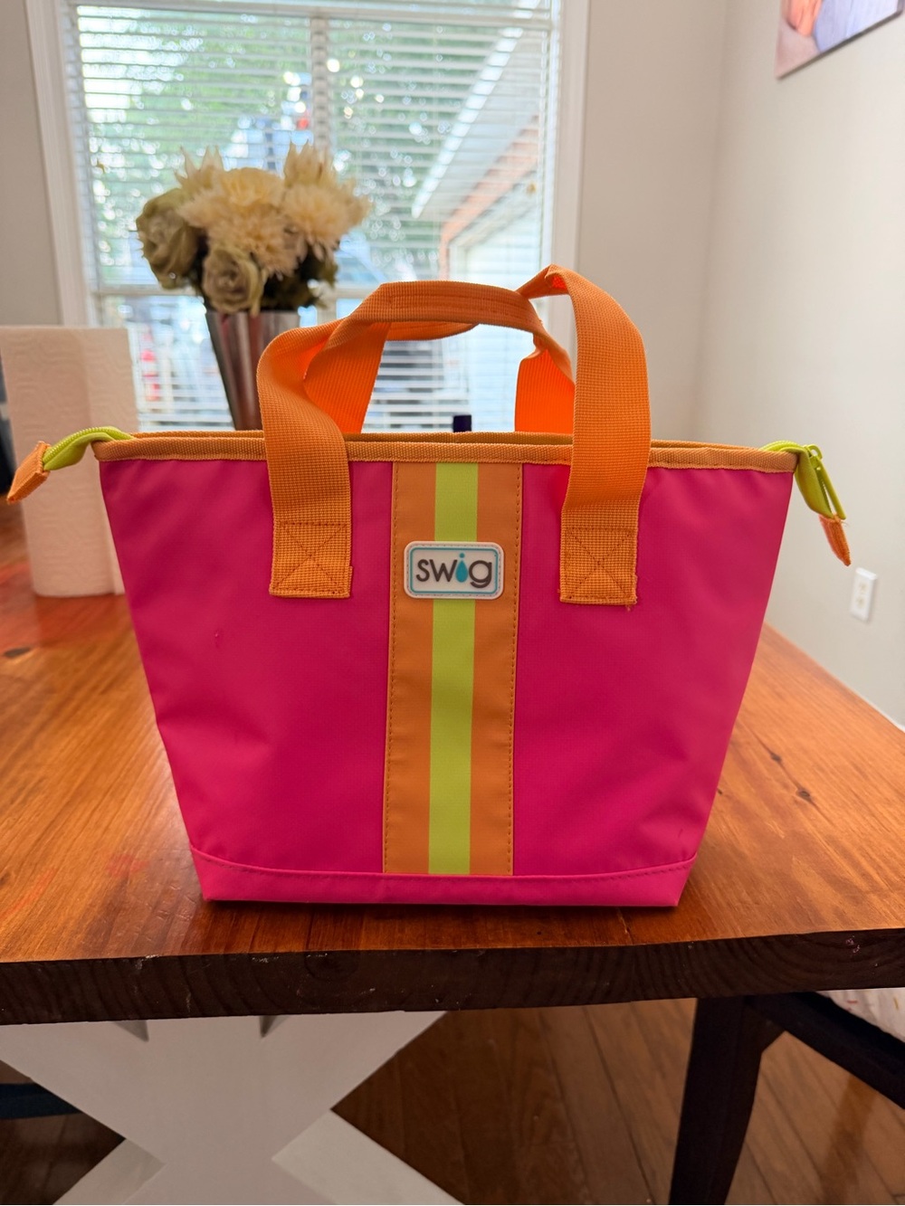 Swig Hot Pink Cooler Tote with Orange & Lime Stripe lunchbox.